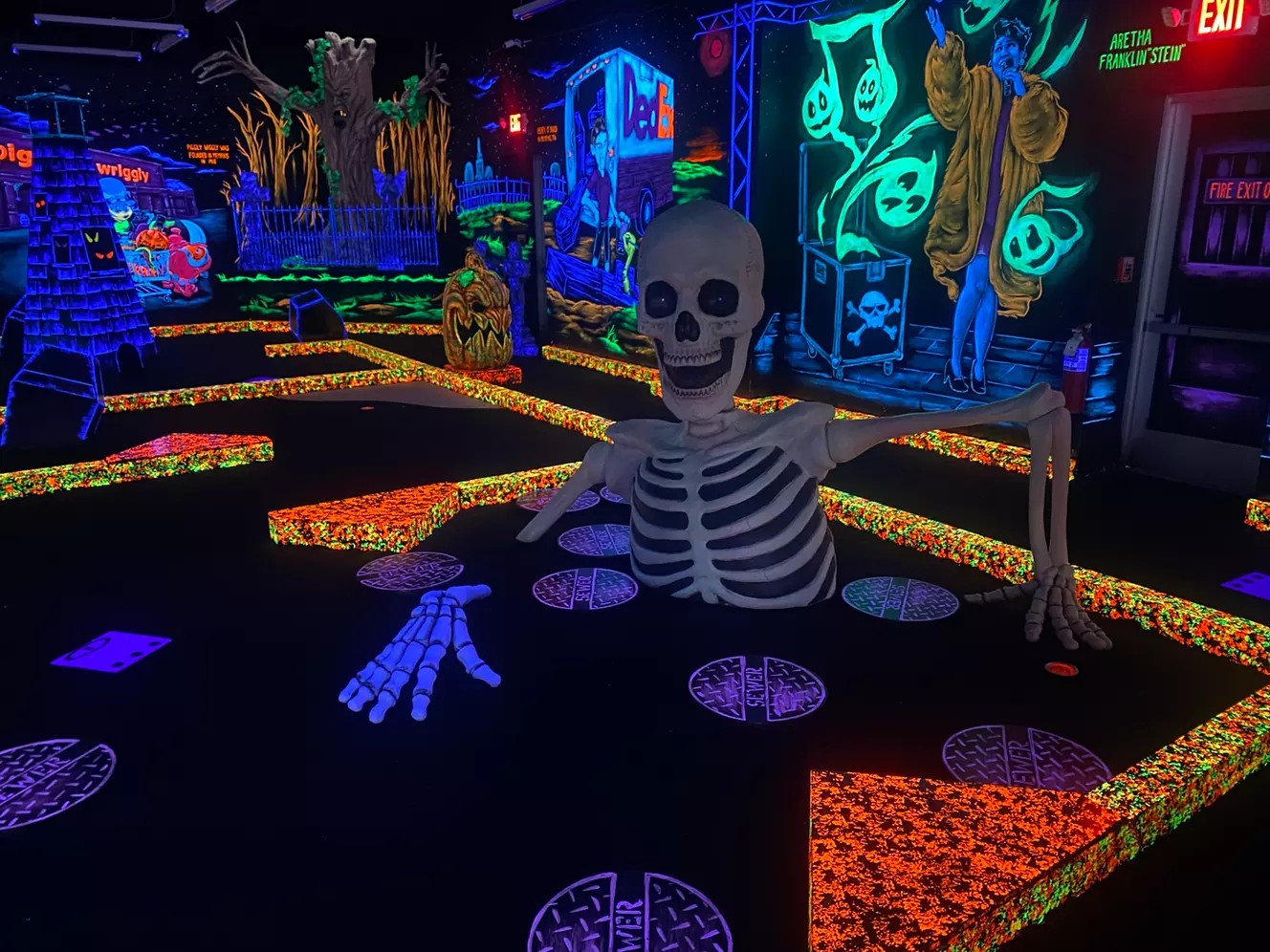 18 Holes of Indoor Blacklight Mini Golf at Monster Mini Golf Cordova (Up to 31% Off)