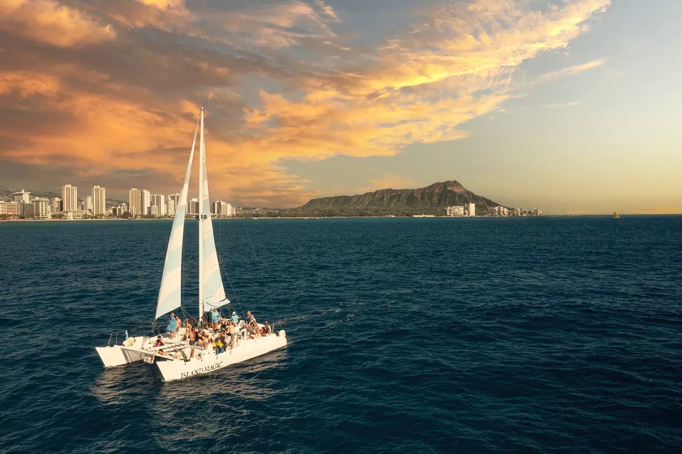 Island Magic Charters: 2-Hour Swim & Sunset Sail in Waikiki for One (Save Up to 35%)