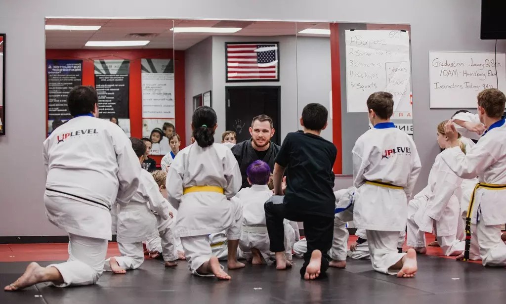 Train Together: One Month of Martial Arts Classes for Individuals or Families (Up to 90% Off)